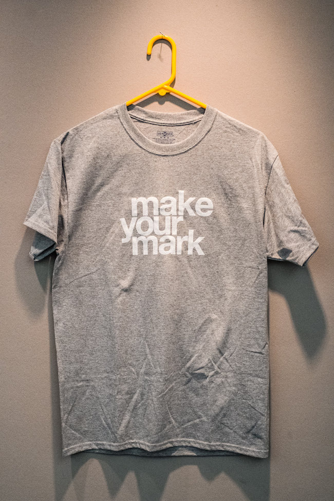 grey t shirt with white writing